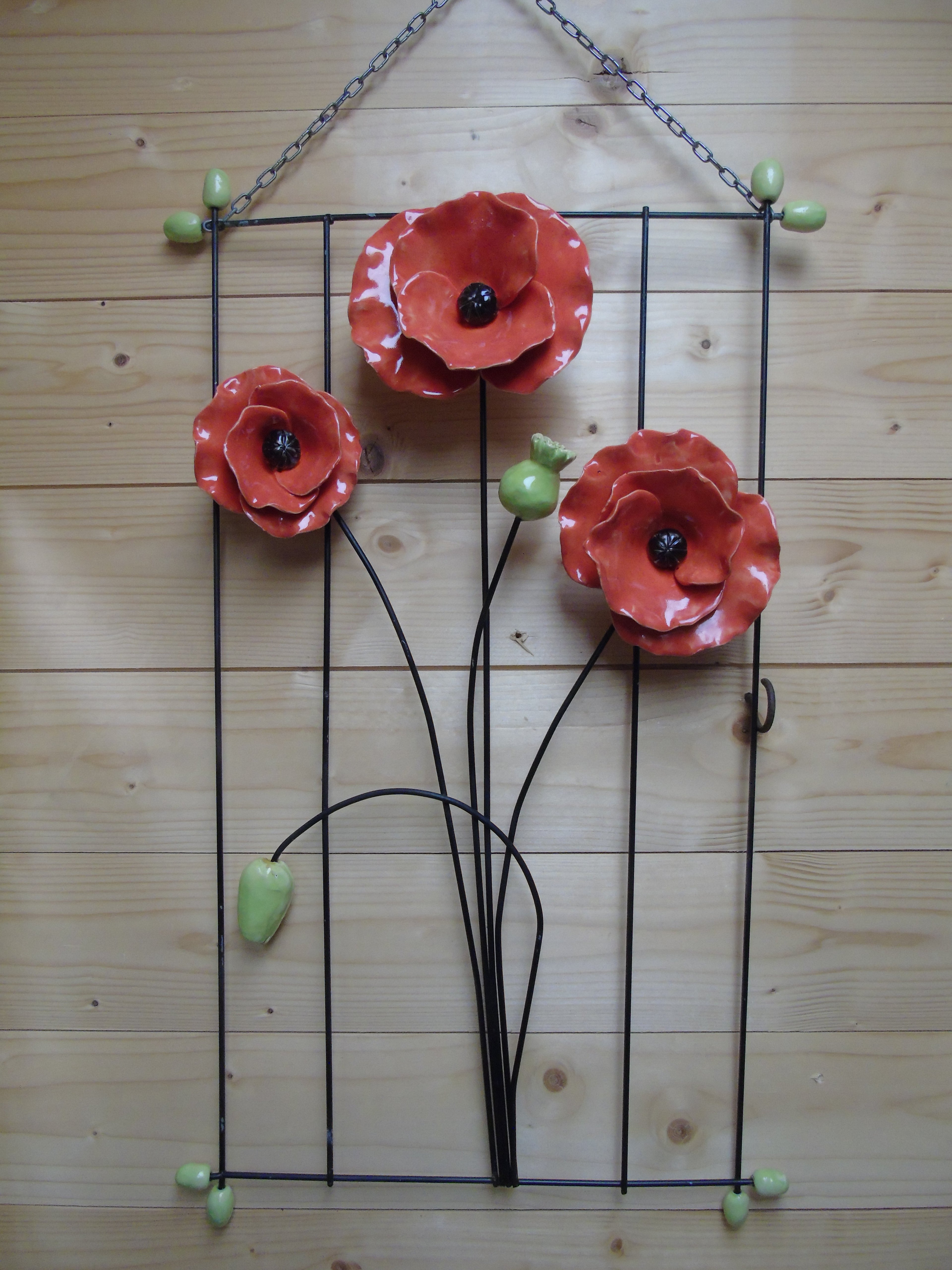 3 klaprozen op metaalrek