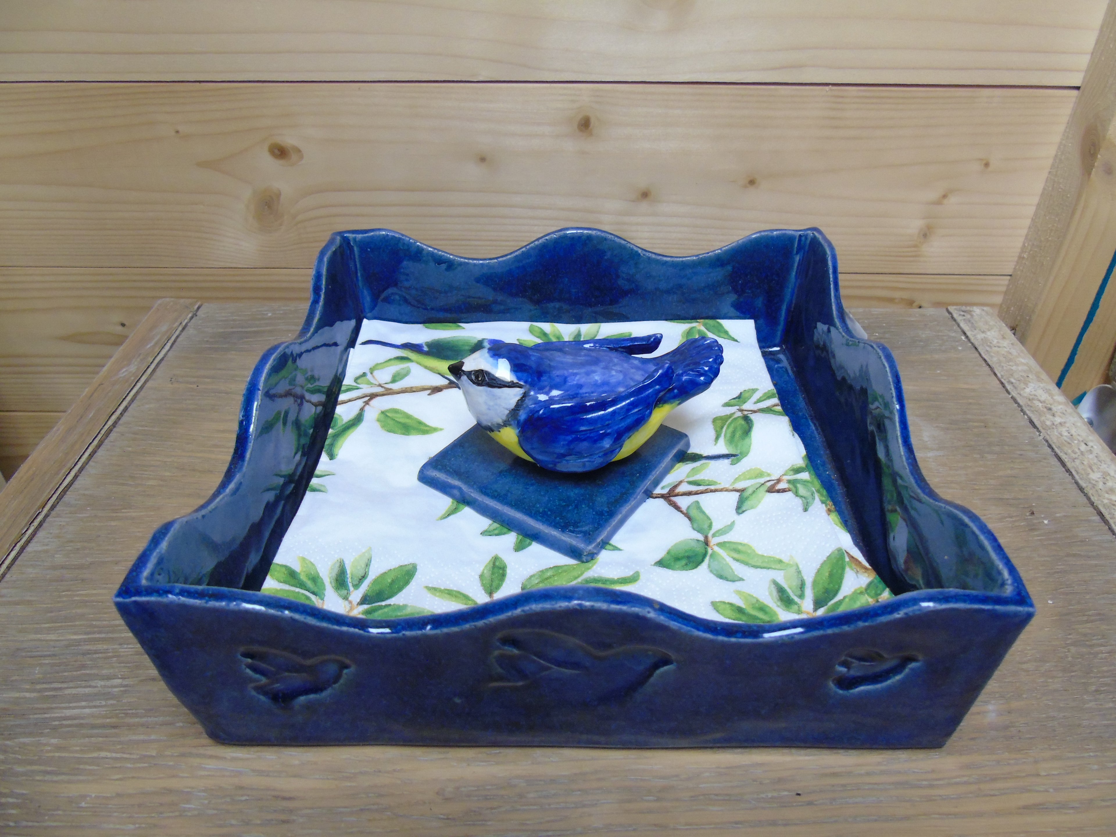 Servettenhouder met een vogeltje als paperpress