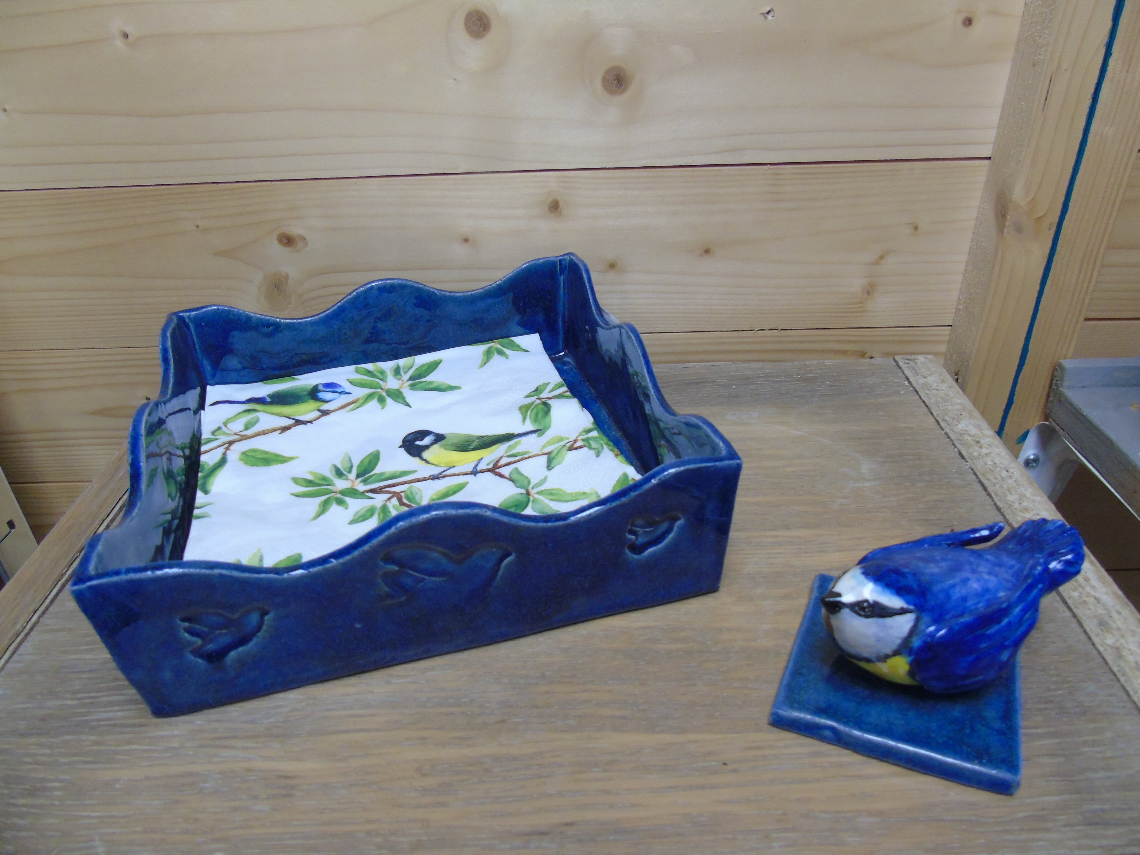 Servettenhouder met een vogeltje als paperpress