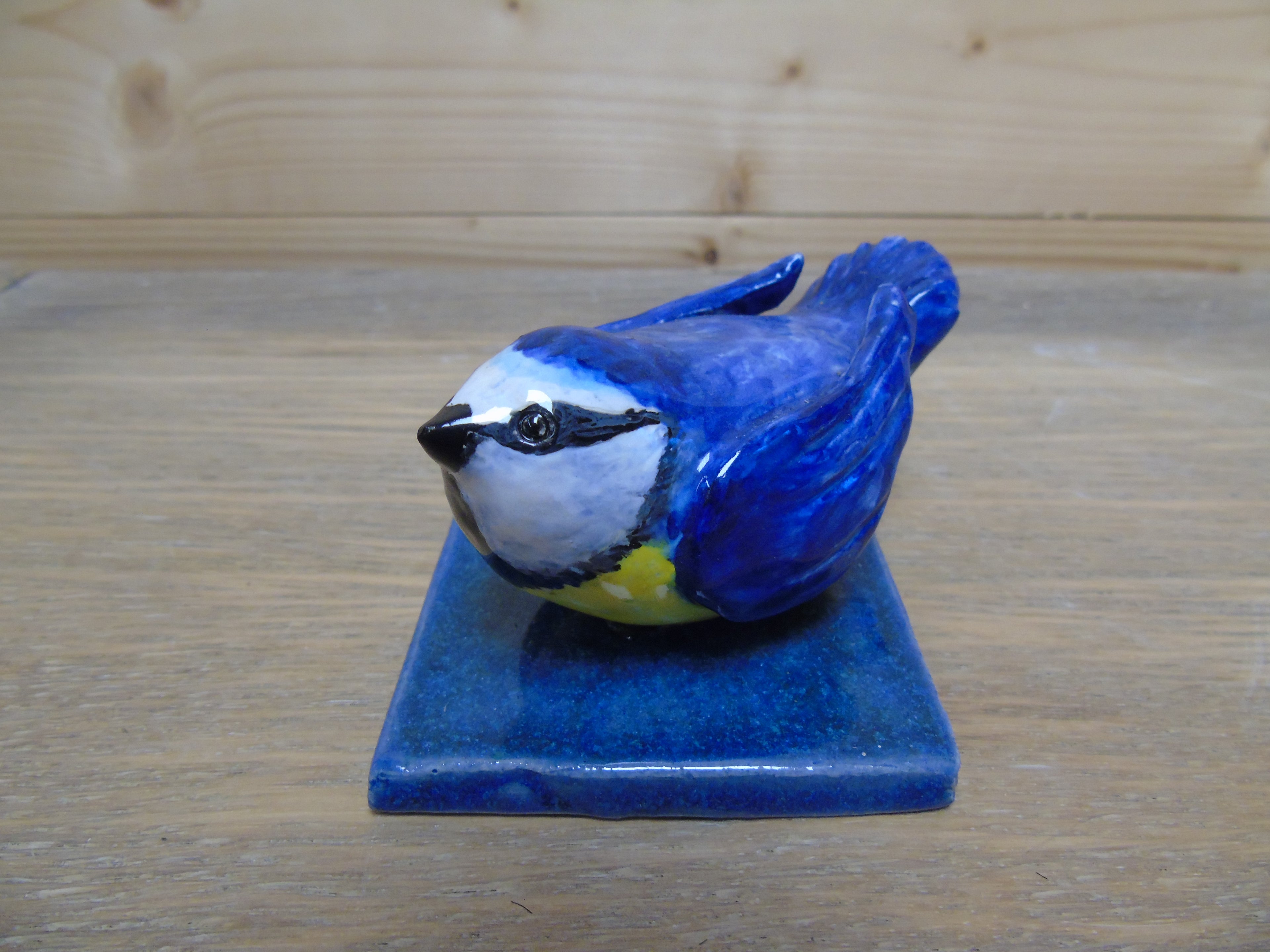 Servettenhouder met een vogeltje als paperpress