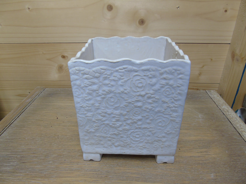 Kleine bloempot op pootjes